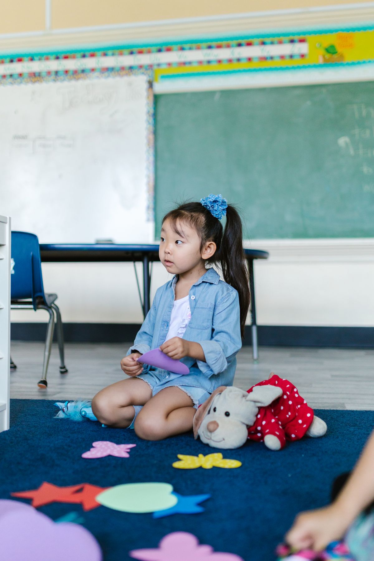 Happy child resting and playing at the Little Lotus daycare centre in Hyderabad