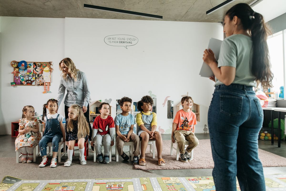Children learning and playing together in a group at Little Lotus preschool